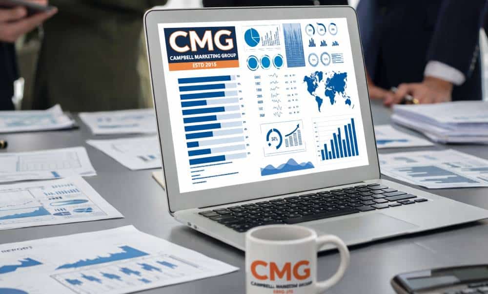 Laptop displaying marketing data and charts