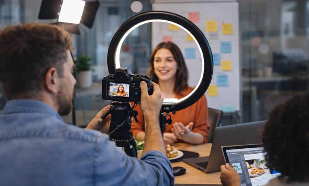 Filming a video with professional setup.